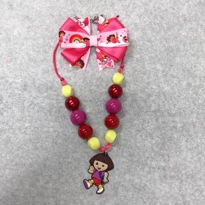 Dora the Explorer necklace & hair bow bundle